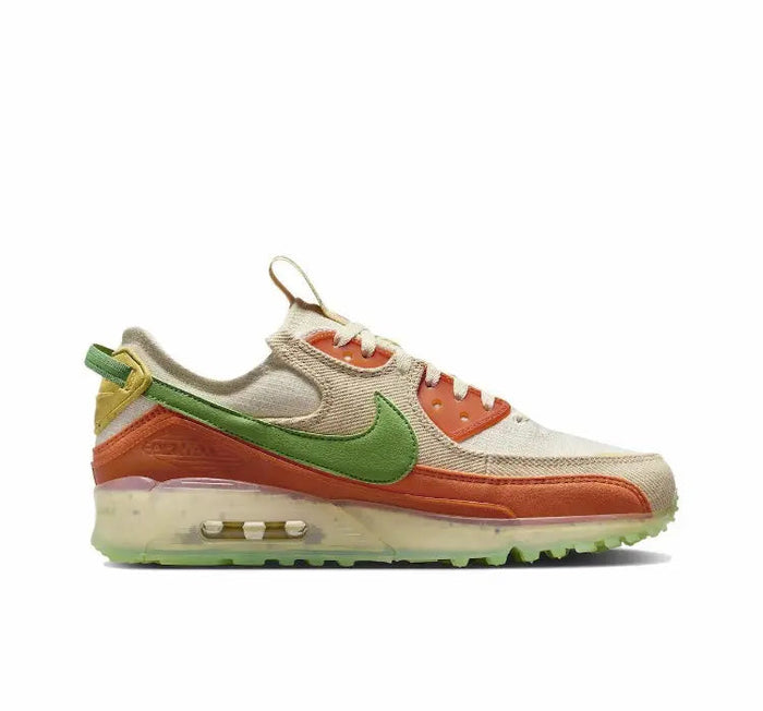 Air Max 90 sneakers side view with off-white upper, green swoosh, orange midsole