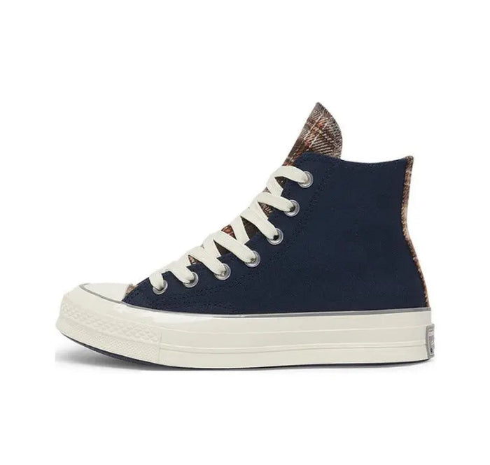 Navy Converse high-top sneaker with plaid collar lining and white laces