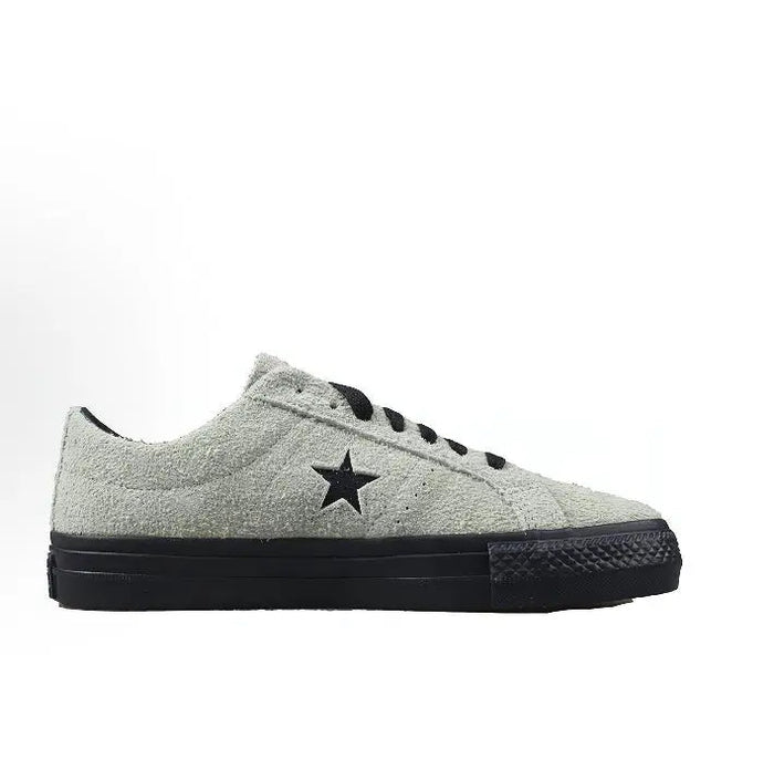 Converse One Star Pro sneaker, light gray upper with black star and lace eyelets.