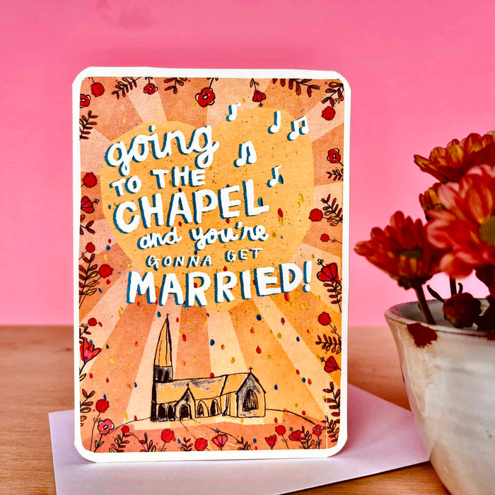 Wedding card showing โGoing to the Chapelโ text, chapel illustration, and floral border