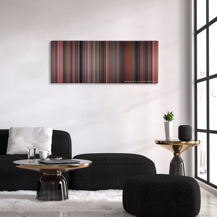 Home Alone color palette canvas above a black sofa with a gold-topped table