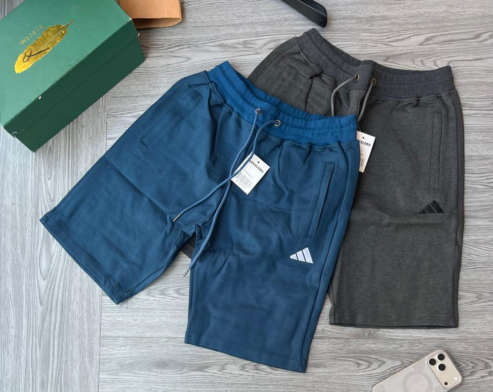 Men's blue and grey Adidas sports shorts