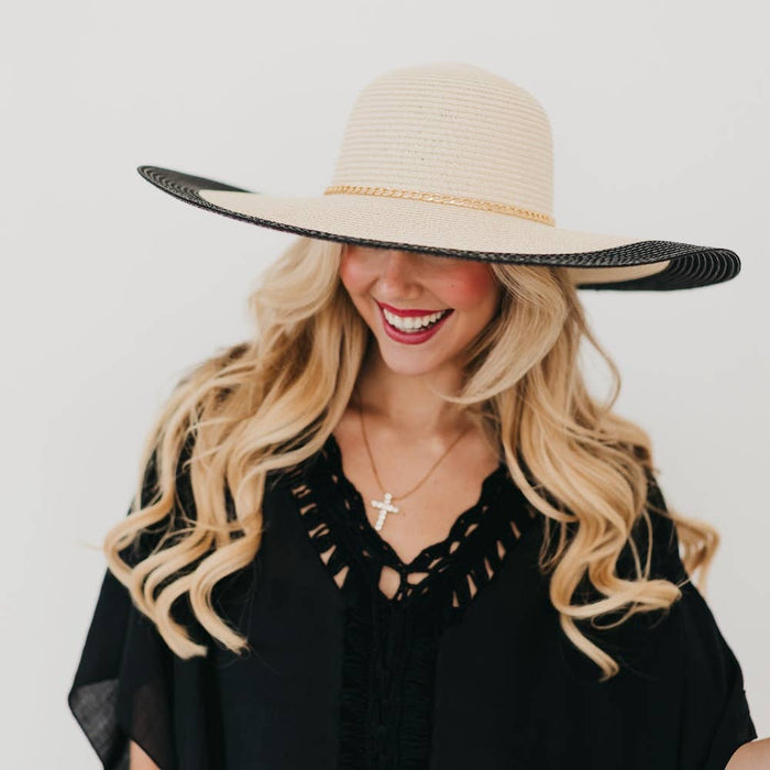 Wide floppy sun hat by Pretty Simple featuring a stylish Miami Summer design and a wide brim for sun protection.