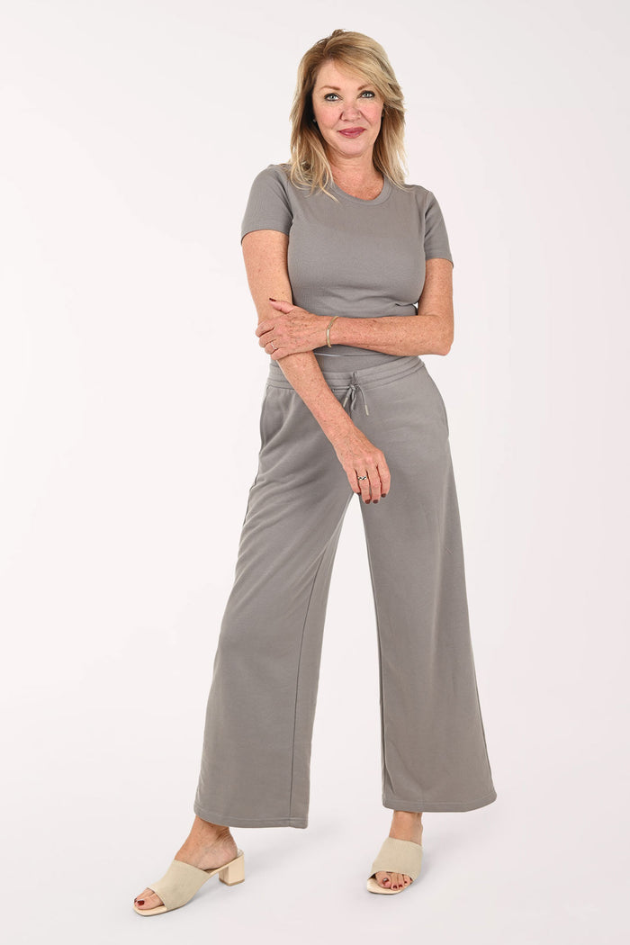 Woman wearing a two piece lounge set in grey