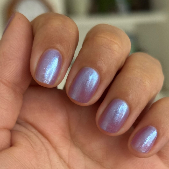 Close-up of short nails painted with SWAK jelly purple-blue iridescent duochrome quick dry polish by Olive and June