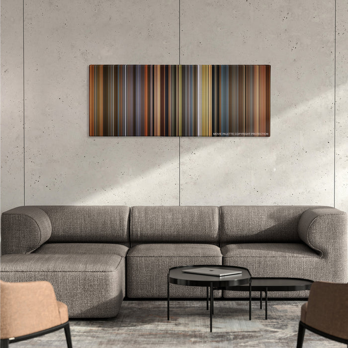 A Beautiful Mind color palette canvas on a concrete wall above a gray sectional sofa