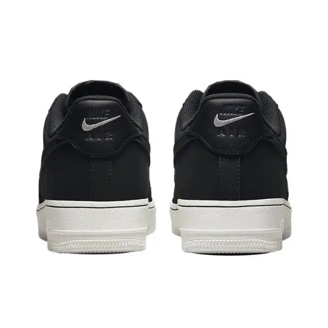 Nike low-top sneaker heel in dark leather with logo patch and white midsole