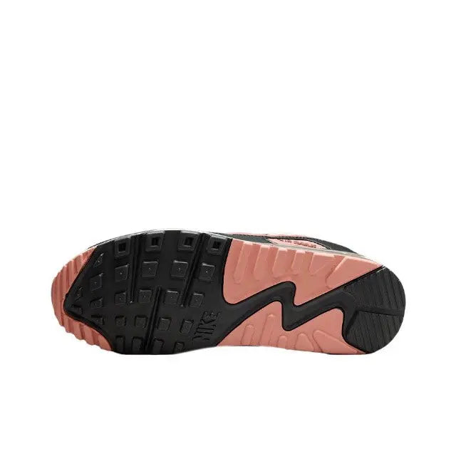 Air Max 90 outsole view: black tread with pink midsole accents