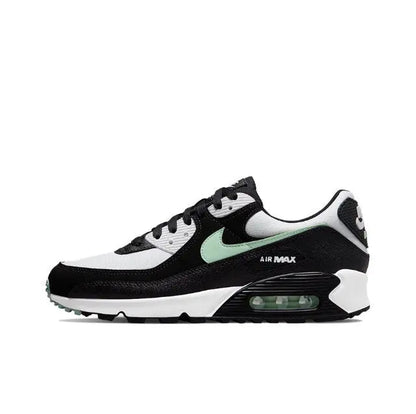 Air Max 90 sneaker side view, white and black with mint swoosh and Air unit