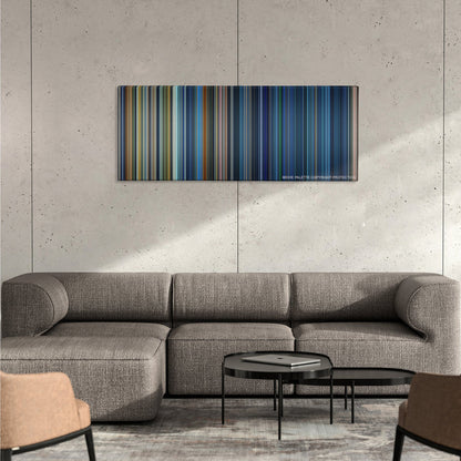 Armageddon color palette canvas on a concrete wall above a gray sectional sofa