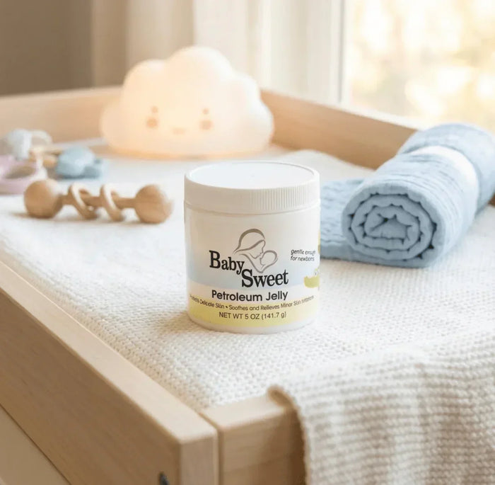 Baby Sweet petroleum jelly jar for newborn rash on changing table with baby essentials