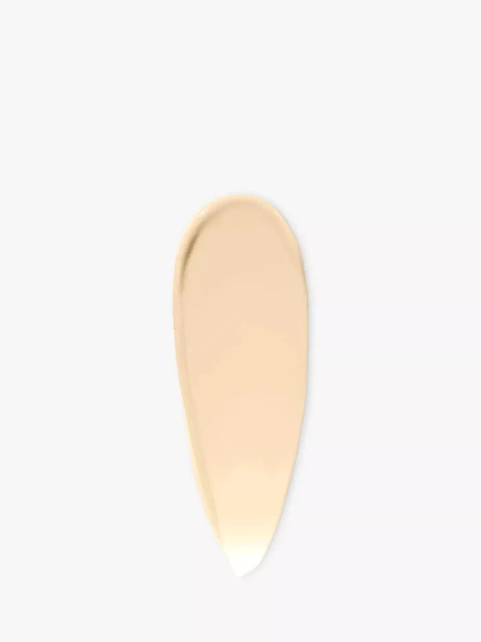 Beige swatch of tinted moisturizer with SPF on a white background