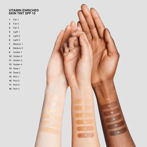 Three arms with various skin tint swatches, labeled by shade for vitamin enriched tint with SPF 15.