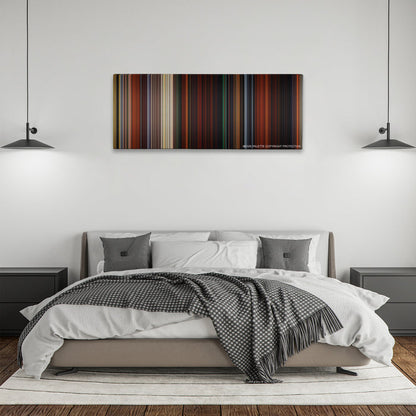 Brave color palette canvas above a bed, between two black pendant lamps