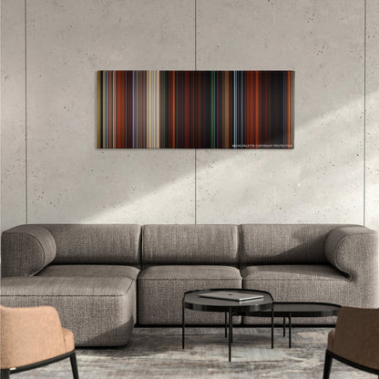 Brave color palette canvas on a concrete wall above a gray sectional sofa