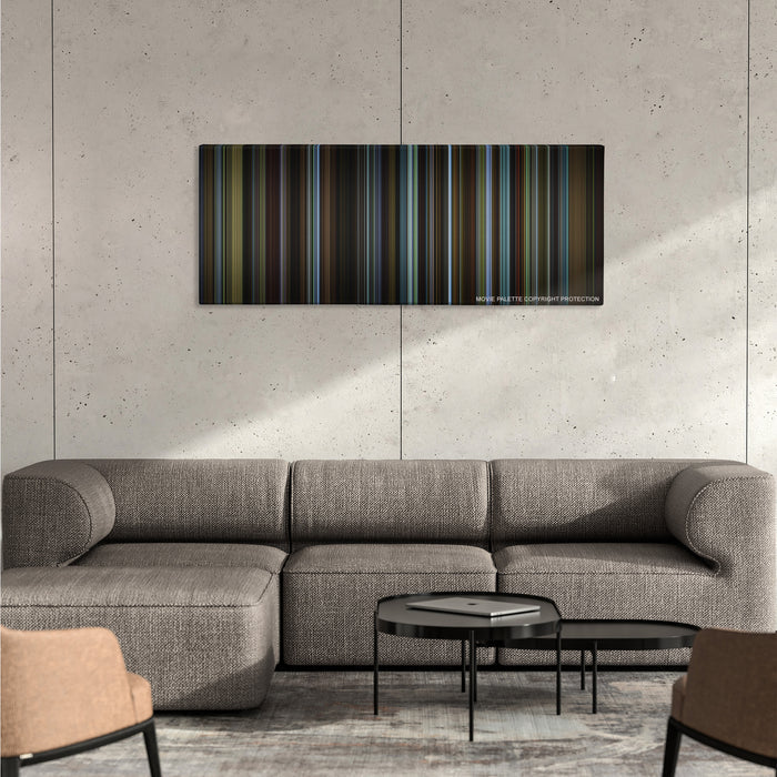 Carol color palette canvas on a concrete wall above a gray sectional sofa