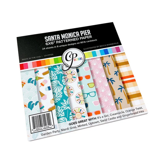 Catherine Pooler - Patterned Paper - Santa Monica Pier. This funky beach and boardwalk themed paper pack is full of summery patterns and seaside prints! From palm trees, waves, tropical leaves to a board short plaid and sunglasses, this pack has it all! Available at Embellish Away located in Bowmanville Ontario Canada.
