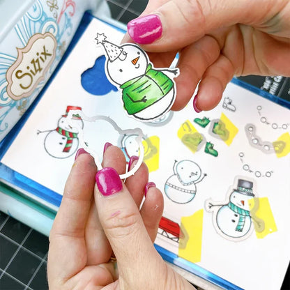 Catherine Pooler - Stamp and Die Set - Snow-rific Party. This stamp and die set is has all the things needed for a winter time party! Each snowman is dressed up for fun and ready to adorn your cards and projects with gifts, cake, balloons and even a sled Available at Embellish Away located in Bowmanville Ontario Canada