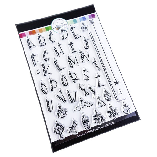 Catherine Pooler - Stamp Set - Dangling Alphabet. A floating alphabet that will hang from your page with the included bar lines. All twenty-six (26) letters are included along with icons for holidays and seasons throughout the year. Available at Embellish Away located in Bowmanville Ontario Canada.