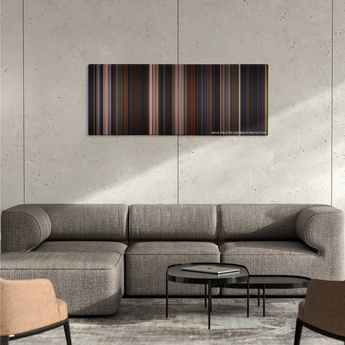 Chicken Run color palette canvas on a concrete wall above a gray sectional sofa