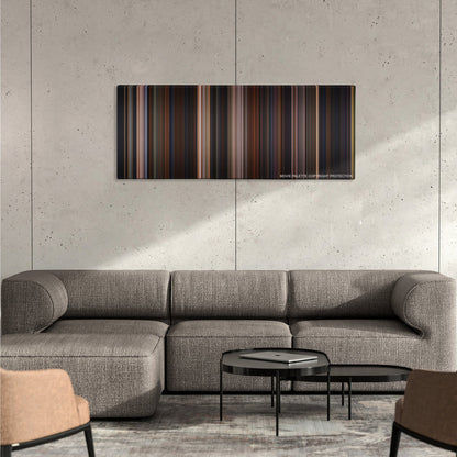 Chicken Run color palette canvas on a concrete wall above a gray sectional sofa