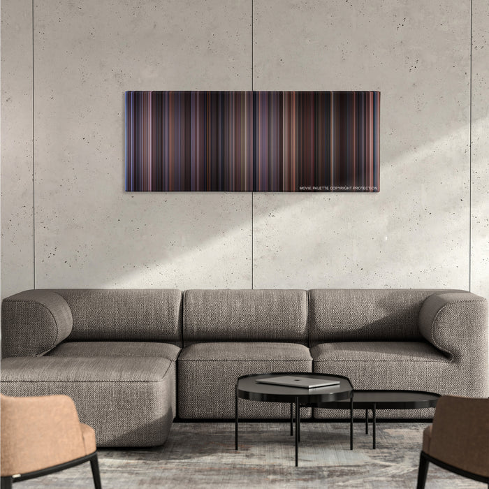 Chocolat color palette canvas on a concrete wall above a gray sectional sofa