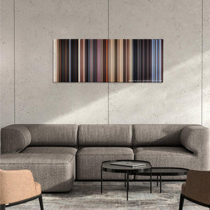 Close Encounters of the Third Kind color palette canvas on a concrete wall above a gray sectional sofa