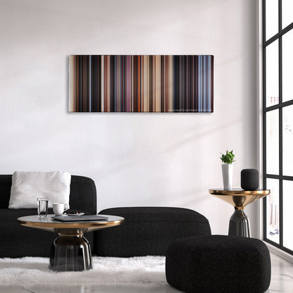 Close Encounters of the Third Kind color palette canvas above a black sofa with a gold-topped table