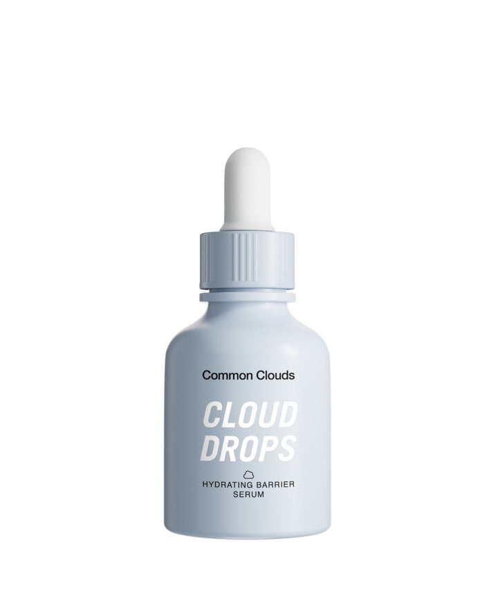 Common Clouds Cloud Drops hydrating barrier serum in a light blue dropper bottle on a white background.