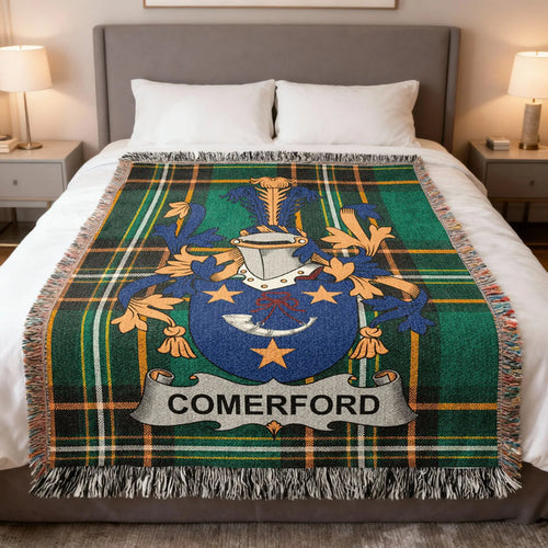 Comerford family crest woven blanket spread over a bed.