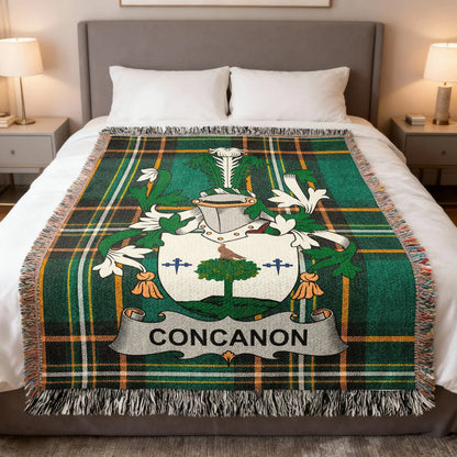 Concannon family crest woven blanket spread over a bed.
