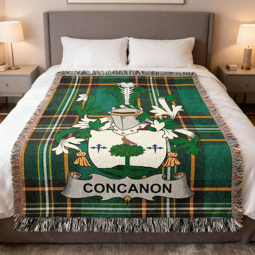 Concannon family crest woven blanket spread over a bed.