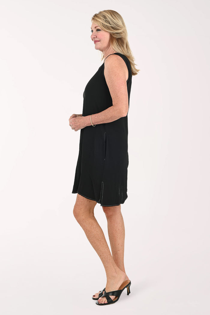 Woman wearing a sleeveless black dress