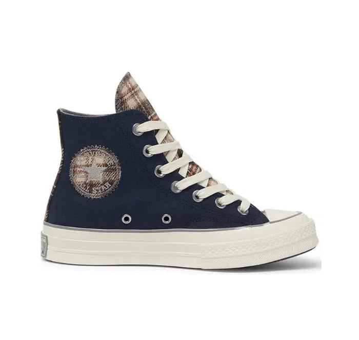 Navy high-top Converse sneaker with plaid collar, white laces, and white rubber toe