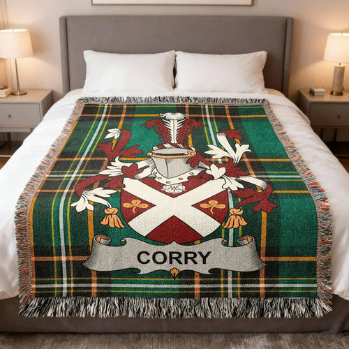 Corry family crest woven blanket spread over a bed.