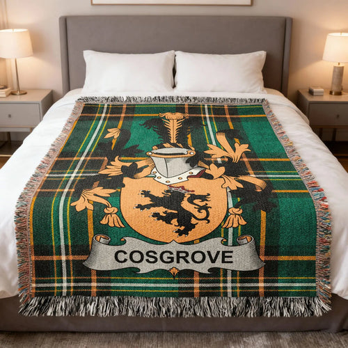 Cosgrove family crest woven blanket folded over a bed.