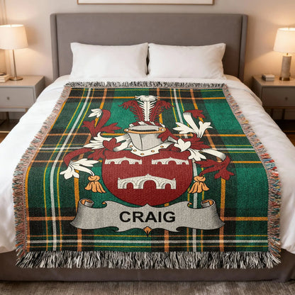 Craig family crest woven blanket spread on a bed.