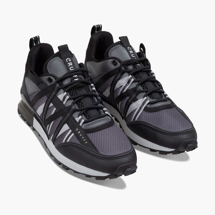Black and gray sneakers with 'CRU' branding on a white background
