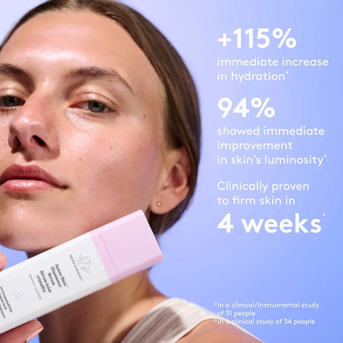 Drunk Elephant Amino Rain Glasswater Serum 30ml beauty product in a clear glass bottle with dropper for hydration.