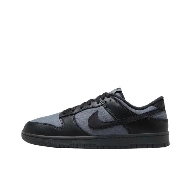 Nike Dunk Low low-top sneaker in dark navy and wolf gray, with black swoosh