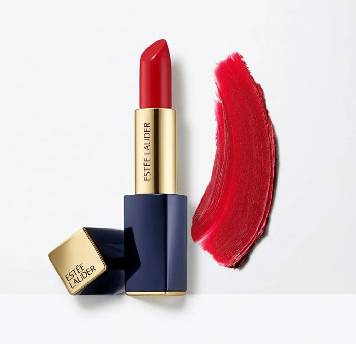 Red lipstick in gold and blue case with matching lipstick swatch on white background