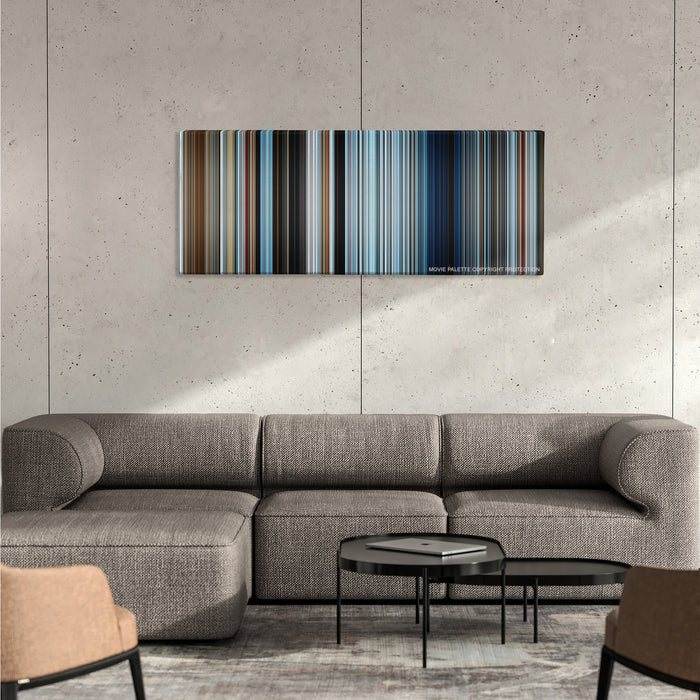 Everest color palette canvas on a concrete wall above a gray sectional sofa