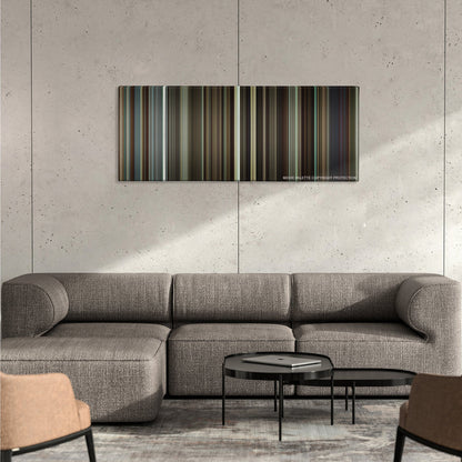 Flight color palette canvas on a concrete wall above a gray sectional sofa