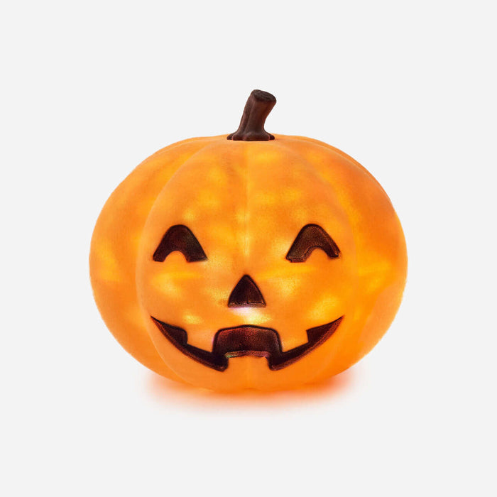 Flocked Jack-O-Lantern with Revolving Lights glowing with a playful carved face for Halloween decor.