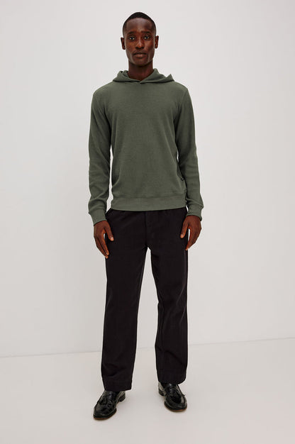 Gates Hoodie in Micro-Waffle Cotton Blend With Fixed Hood, Long Sleeves, and Relaxed Fit in Pine Needle Colorway - Full Body Front View Featured on Model