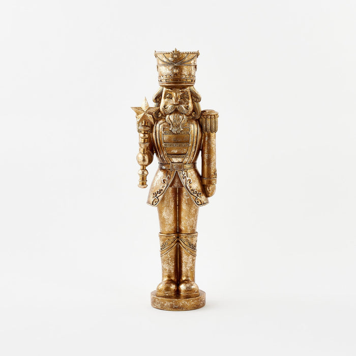 Decorative nutcracker figurine with intricate details on a white background