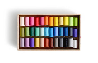 Box of colorful pastels by Ohkan Kagaku Kogyosyo on a white background