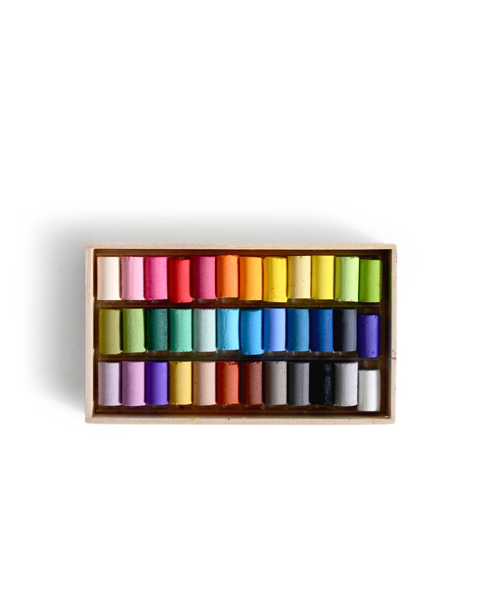 Box of colorful pastels by Ohkan Kagaku Kogyosyo on a white background