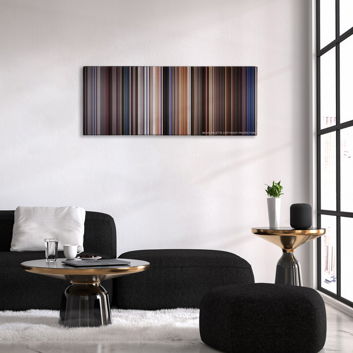 Highlander color palette canvas above a black sofa with a gold-topped table