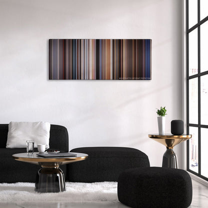Highlander color palette canvas above a black sofa with a gold-topped table